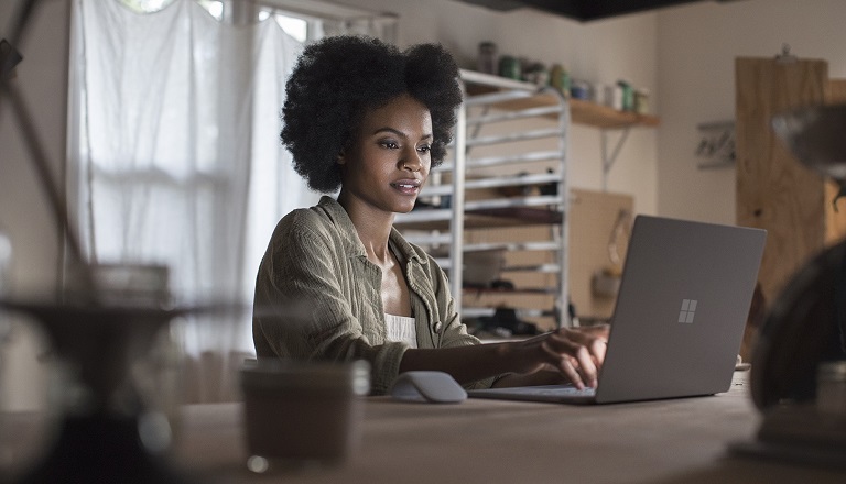 Woman works at a laptop