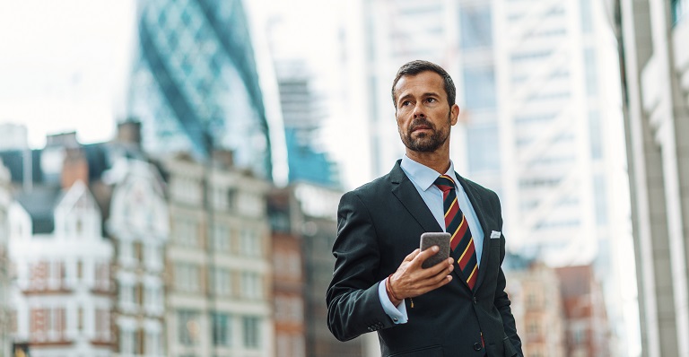 Handsome Canadian exporter walks to meeting in London.